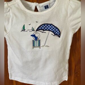 Girl’s white tee with embroidered umbrella, and matching shorts